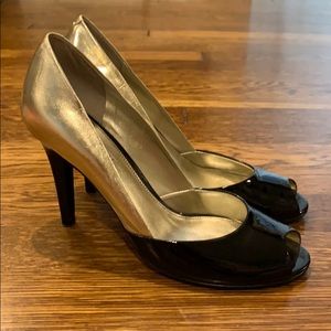 Gold and black patent leather pumps